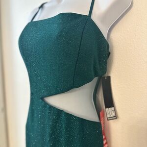 emerald green, spaghetti strap, asymmetrical design, Maxi length, brand new.
